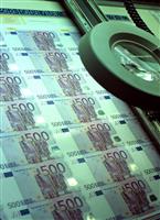 Euro banknotes under the magnigying glass